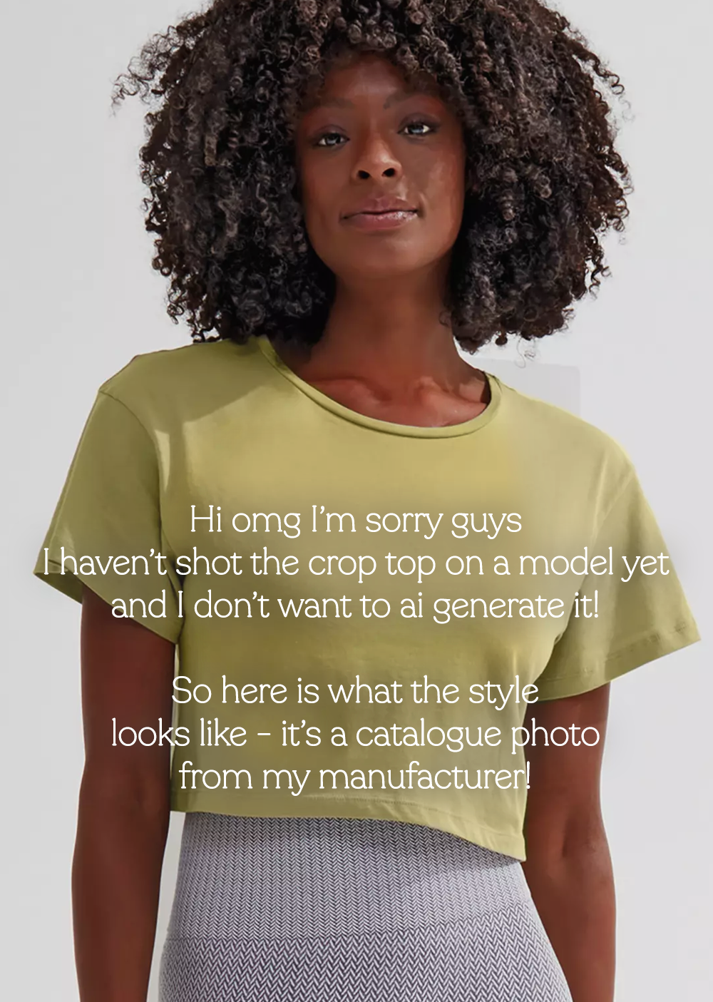 Woman wearing a green t-shirt with text overlay on a plain background